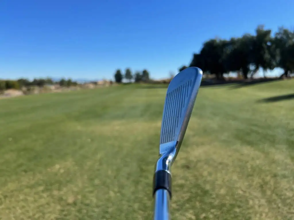Kirkland Signature iron seen edge-on at address on the fairway