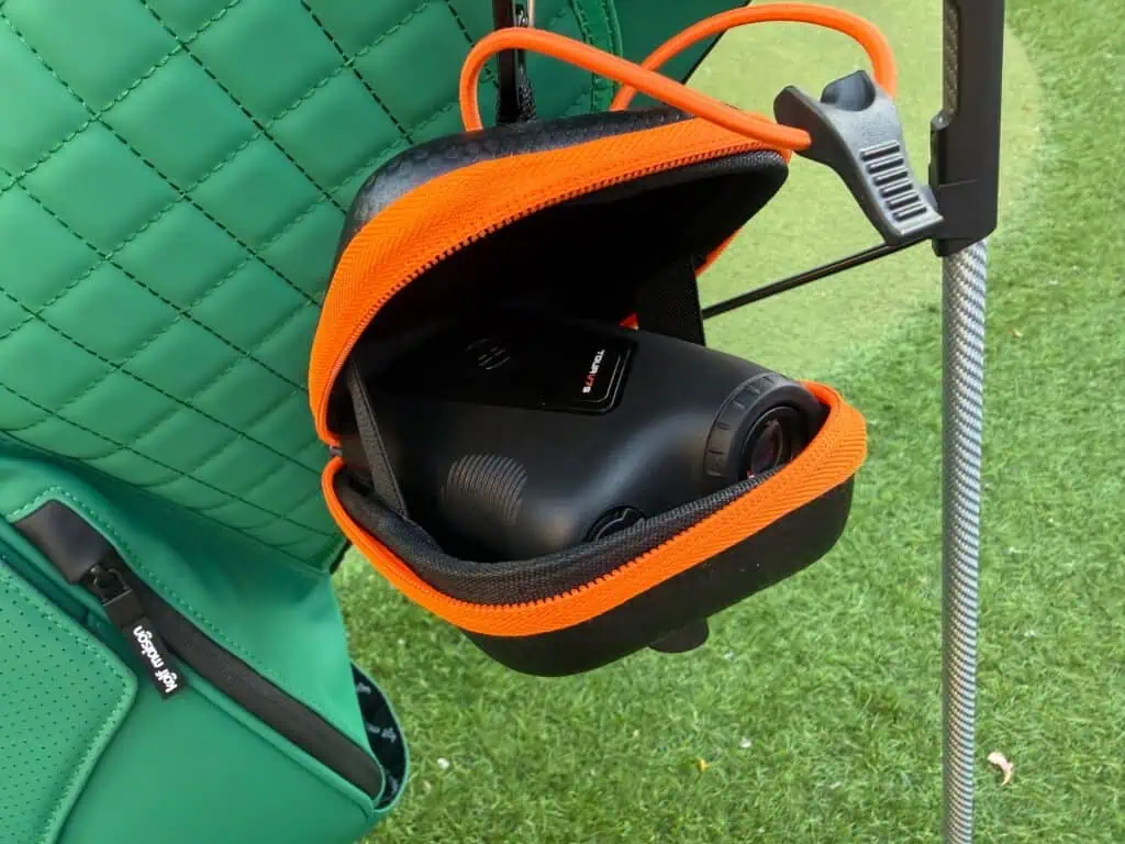 The V7 Shift in its open hard case on a golf bag