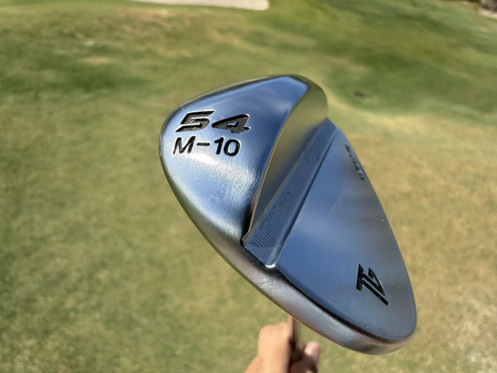 54-degree M-grind Tour-W wedge showing its stamp