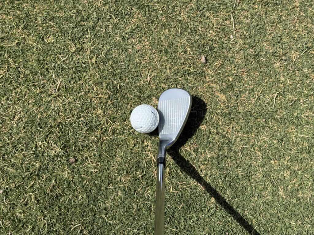 M-grind Tour-W wedge at address behind the ball