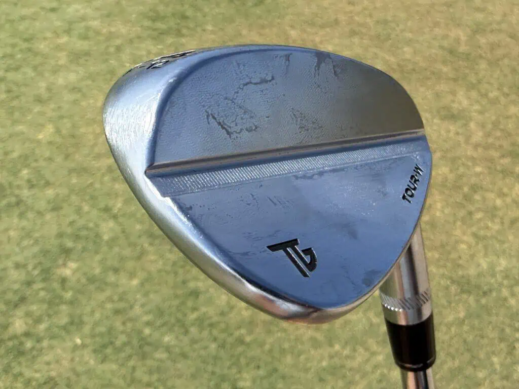 Tour-W wedge face sitting on the turf