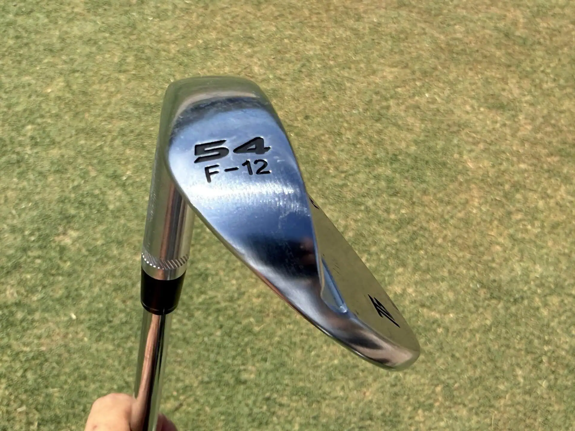 54-degree F-grind Tour-W wedge showing its stamp